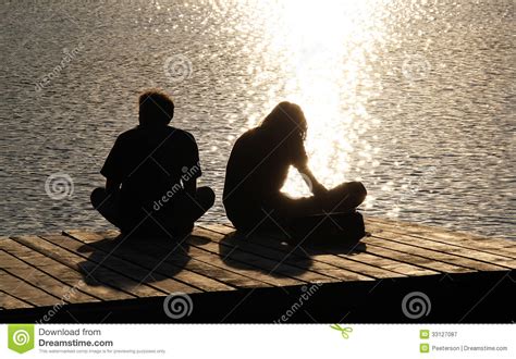 Silhouettes Of Two Young People Stock Image Image Of