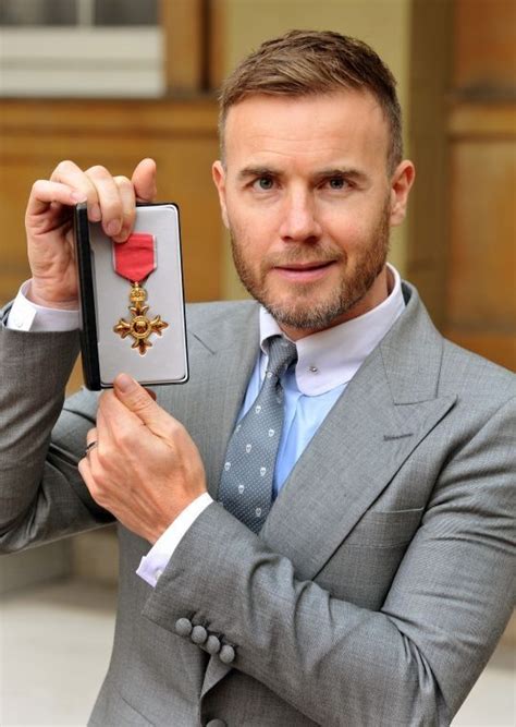 gary barlow gary barlow robbie williams take that investiture ceremony mark owen queen kate