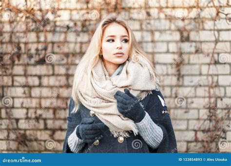 Young Beautiful Blonde Woman With Fashionable Warm Scarf Near Stock