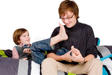 Older Brother Is Tickling The Young One Royalty Free Stock Images