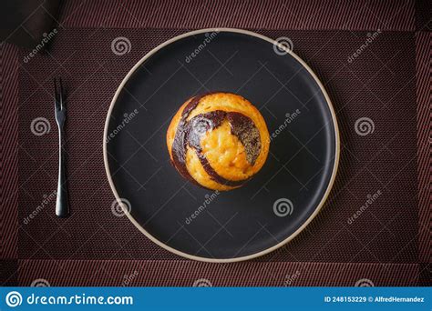 Vanilla Muffin With Chocolate Marbled In Brown Paper Stock Image