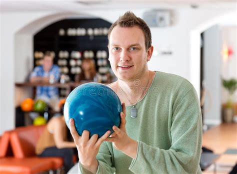 Man Holding Blue Bowling Ball In Club Royalty Free Stock Photo Image
