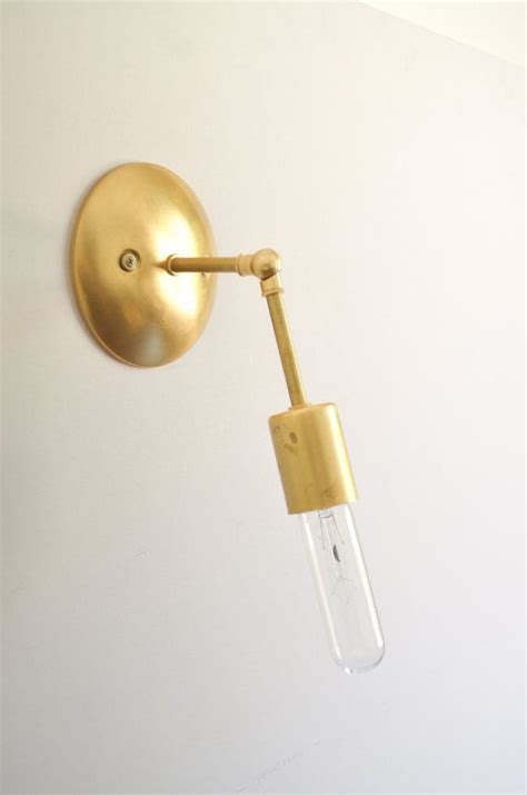 Chic modern style, quality craftsmanship and functional elements make this adjustable arm wall sconce one of our favorites! Gold & Brass Industrial modern minimalist mid century wall ...