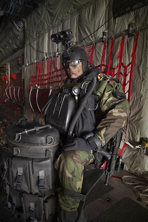 Us Navy Seal Combat Diver Prepares For Halo Jump Operations Poster