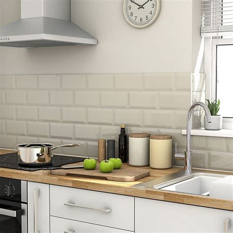 To balance out the use of dark cabinets and countertops, which look stunning, a light floor and ceiling were necessary to keep this kitchen from feeling too dark and enclosed. Trentie Ivory Gloss Ceramic Wall tile, Pack of 40, (L ...