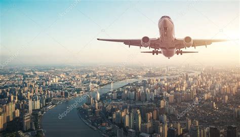 The Plane Flying Over The City Stock Photo Affiliate Flying