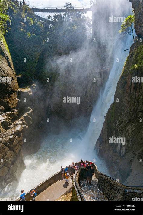 Tourists At El Pailón Del Diablo Waterfall Near Baños In Ecuador Stock