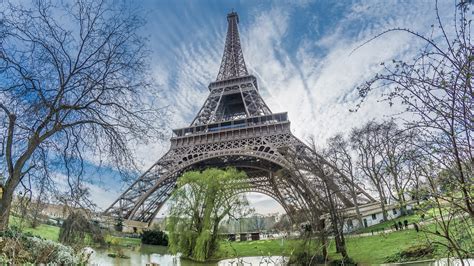Upward View Of Paris Eiffel Tower With Background Of Sky And Clouds Hd