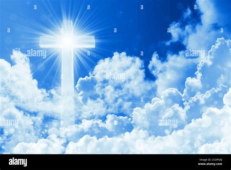 Concept Of Christian Religion Shining Cross On The Background Of Cloudy