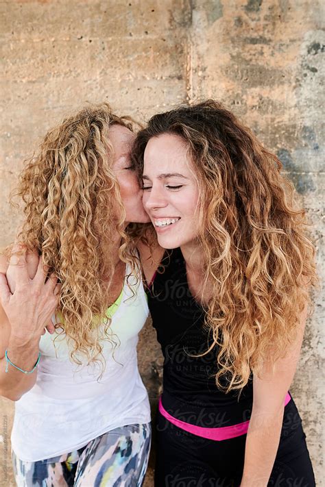 Mom Kissing Her Daughter After Working Out By Stocksy Contributor