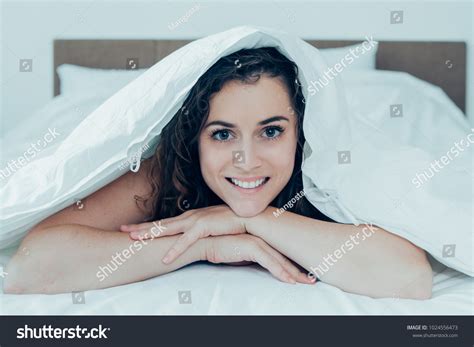 Smiling Beautiful Woman Lying Under Blanket Stock Photo 1024556473