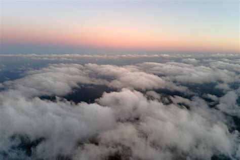 Premium Photo Aerial View From Above At High Altitude Of Dense Puffy