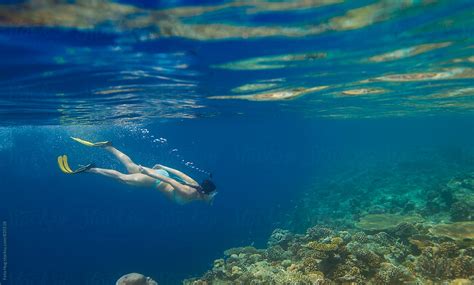 Woman Snorkelling In The Maldives By Stocksy Contributor Eyes On Asia Stocksy
