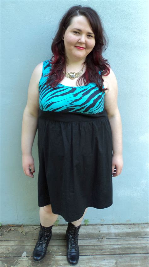 Zebra print bust, high elasticized waist, and black skirt. BeBop size