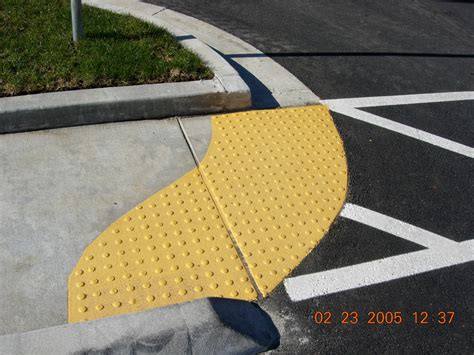 What The Heck Are All These New Yellow Bumps On Every Street Corner