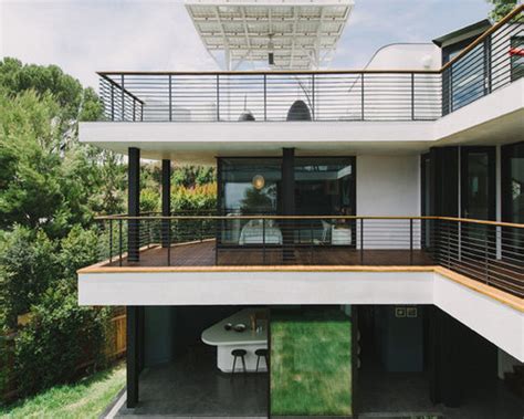 The staircase is modern in design without risers and a transparent parapet. Second-Story Balcony Ideas, Pictures, Remodel and Decor