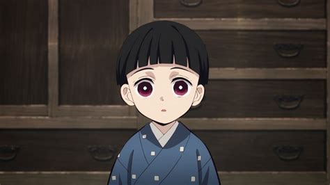 An Anime Character With Black Hair And Big Eyes Standing In Front Of A