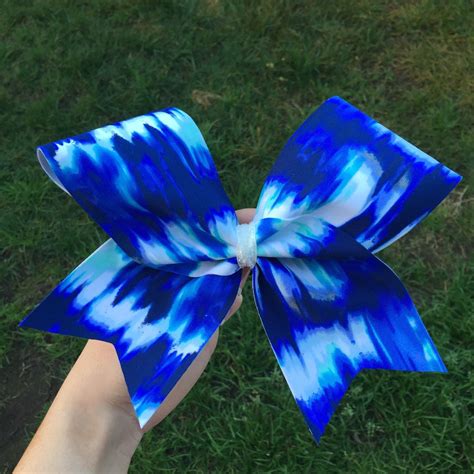 Maybe you would like to learn more about one of these? blue tie dye cheer bow by BowSugar on Etsy https://www.etsy.com/listing/221548613/blue-tie-dye ...