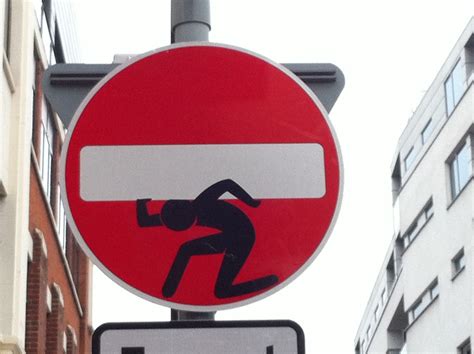 Photos London Traffic Sign Artbomber Uses Stickmen To Question
