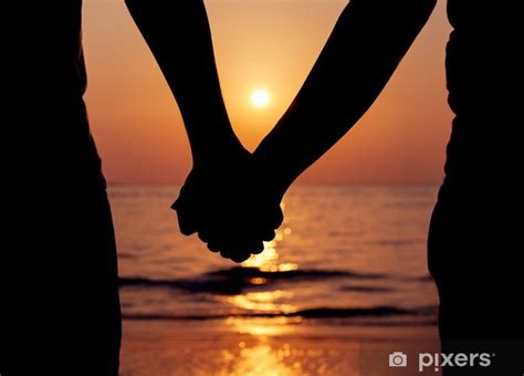 Wall Mural Silhouettes Couples Holding Hands On Sunset Pixersca