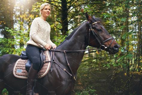 Lady Riding A Brown Horse In Park High Quality People Images