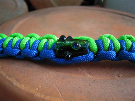 This paracord bracelet is incredibly durable and will not slide off your wrist. Blue and Green Paracord Survival Bracelet - Green Glass Bead - 8 Inch - Buy Happy Glass