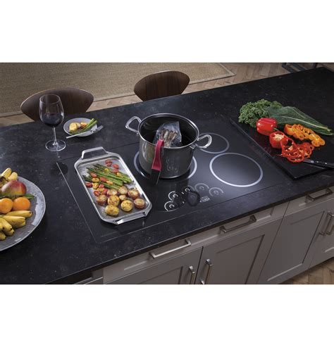 Spills and food residue remain on the surface each day, which requires cleaning. ZHU36RDJBB - Monogram 36" Induction Cooktop - The Monogram ...