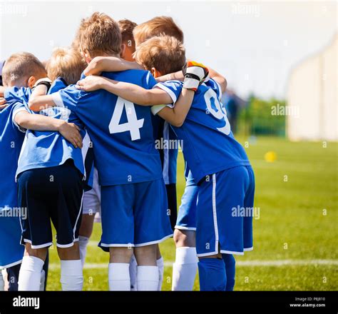 Boys Sports Team With Coach Youth Soccer Team Huddle With Coach