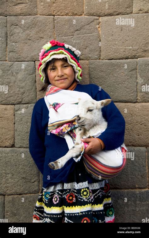 Peru Cuzco Unesco World Heritage Site Young Girl Holding Baby Lamb