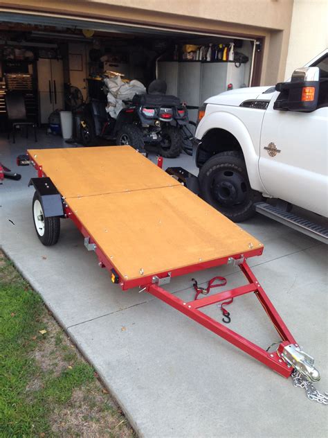 When the job's done, just fold the working platform up and take it away with its convenient carry handle. Nice folding trailer solves storage and transportation ...