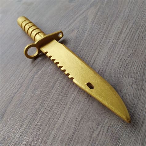 A Large Golden 9 Piece Wooden Weapon Set T For Gamers Etsy