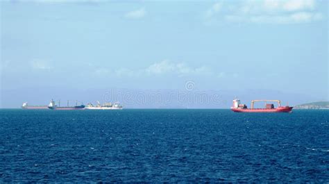 Merchant Vessels And Cargo Container Ships Entering The Port Editorial