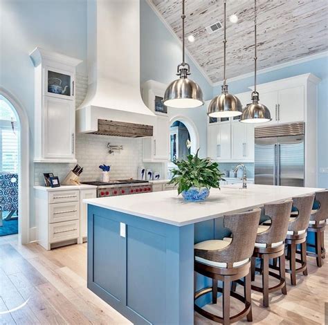 Kitchen cabinets are in a navy blue delivering a great contrast to the white kitchen island countertop. Blue Island......"I thank you God for this most amazing ...