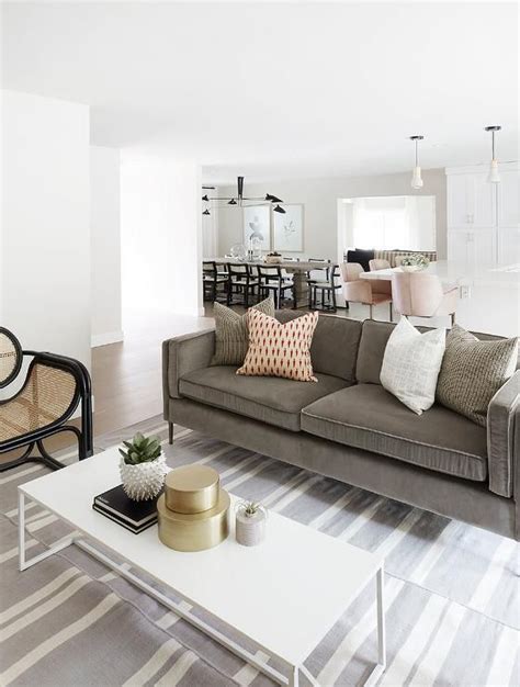 Living room couches are an investment purchase but rest assured, these pieces can last up to 15 years. Gray velvet sofa with a white coffee table atop a white ...