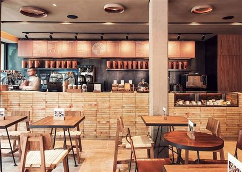 The café is located at the the strand kota damansara. Bright interior with earth colors and wooden elements in ...