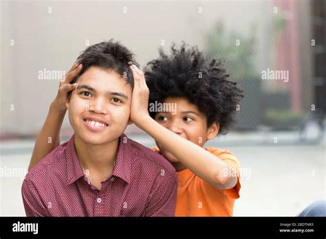 Young Mixed Race Teenage Brothers Looking At The Camera Stock Photo Alamy