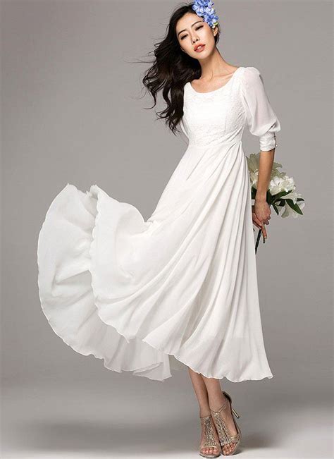 half sleeve white maxi dress with lace details on the front bodice and cuff white flowy dress