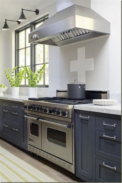 The same charcoal kitchen cabinets with brushed nickel give the room more a transitional feel. Image result for navy blue cabinets with with brushed ...