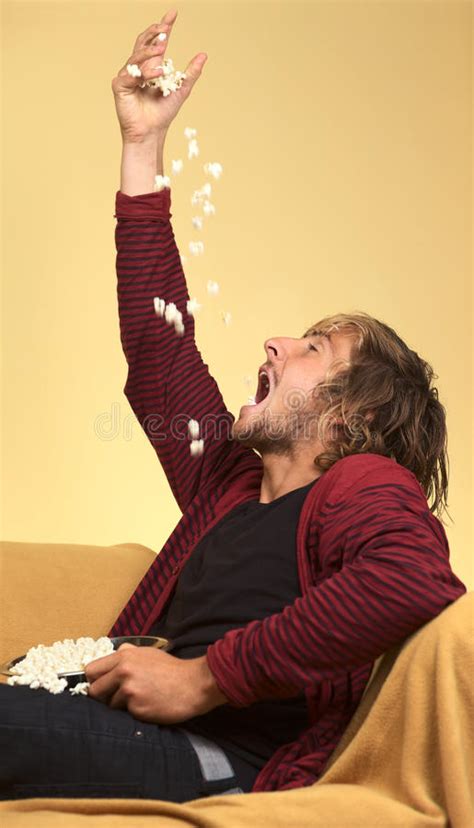 Young Man Eating Popcorn Stock Image Image Of Young 21239399