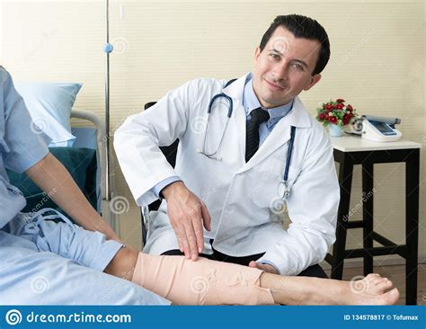 Team Of Doctor Examining A Female Patient Stock Image Image Of People