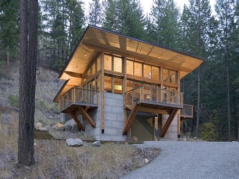 Those moving out west would often build barns with high, steep roofs that allowed for plenty of storage space and a central hallway. Cabin Built into Hillside Plans Homes Built into Hillsides ...