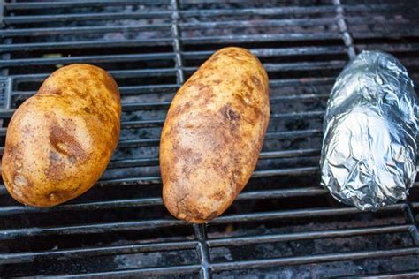 Baked potatoes are done when a fork pierces the center easily. How to Cook Baked Potatoes on a Charcoal Grill | Making ...