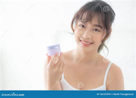 Beautiful Portrait Young Asian Woman Holding And Presenting Cream Or Lotion Product Beauty Asia