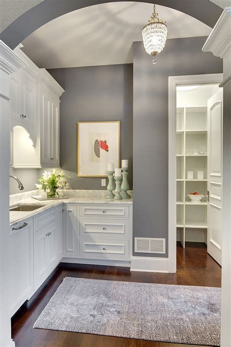 A warm light gray cabinet paired with a dark red accented wall makes for a sophisticated kitchen, while a brighter red can make it more of a playful space. mindful gray low light - Google Search | Grey kitchen ...