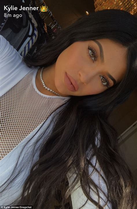 Kylie Jenner Flashes Her Bountiful Bosom In White Mesh Top Daily Mail Online