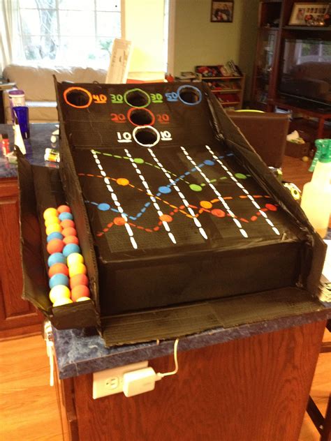 Check spelling or type a new query. Cardboard box skee ball machine. Spray painted. | Cardboard art projects, Cardboard crafts ...