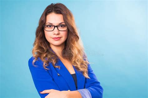 Portrait Of Happy Smiling Young Cheerful Businesswoman In Glasses Over