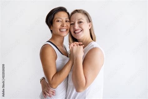 Happy Lesbian Couple Embracing And Looking At Camera Multiethnic Homosexual Couple Holding