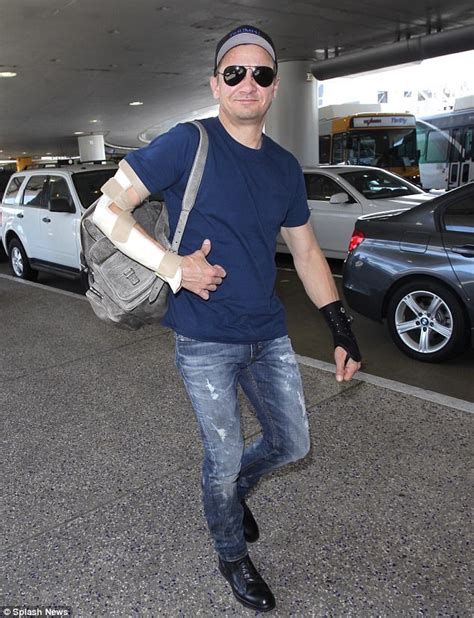 Jeremy Renner Cracks A Smile At LAX After Arm Injuries Daily Mail Online