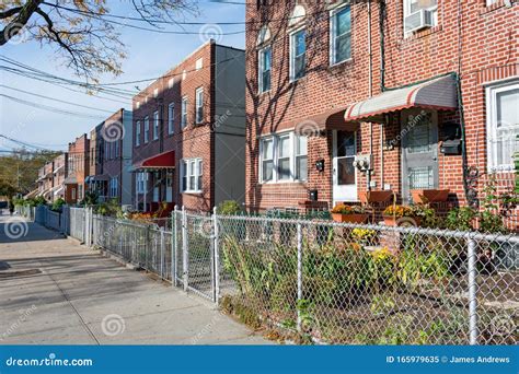 A Row Of Old Fenced In Homes In Astoria Queens New York Stock Image